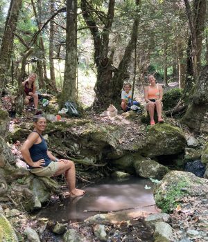 A lunch break with a walking group by the stream of Kosmas